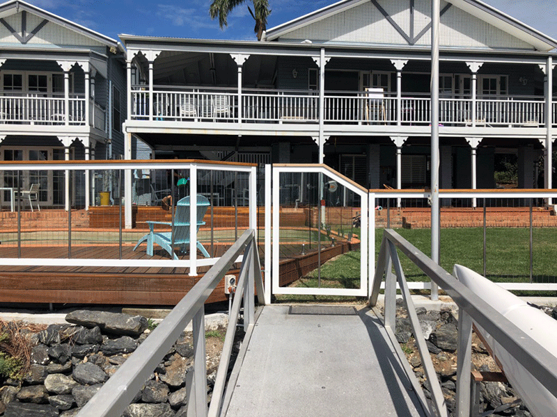 Sentrel Vertical Cable Balustrade and Pool Fencing. Colour: Zeus White with Spotted Gum